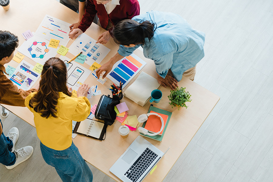 A group of people working together around a table