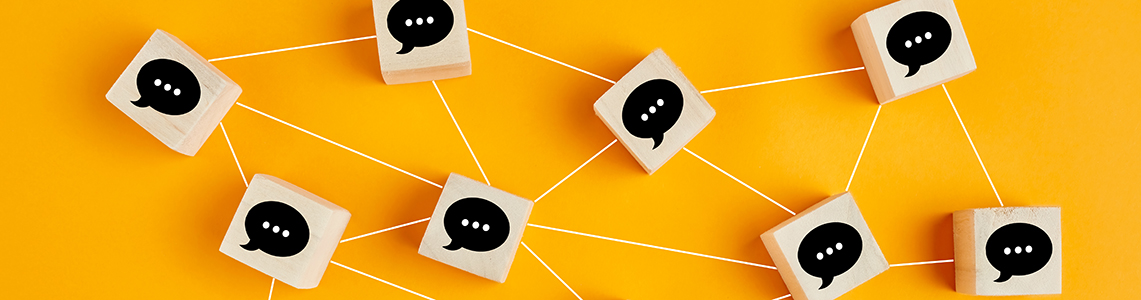 A network of cubes with speech bubbles on connected by lines