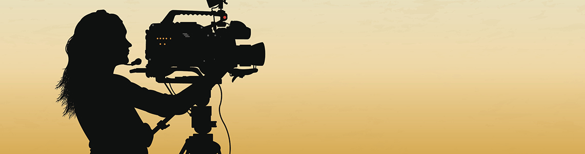 A person using a video camera