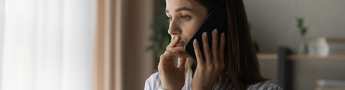 A person using a mobile phone to make a phone call.