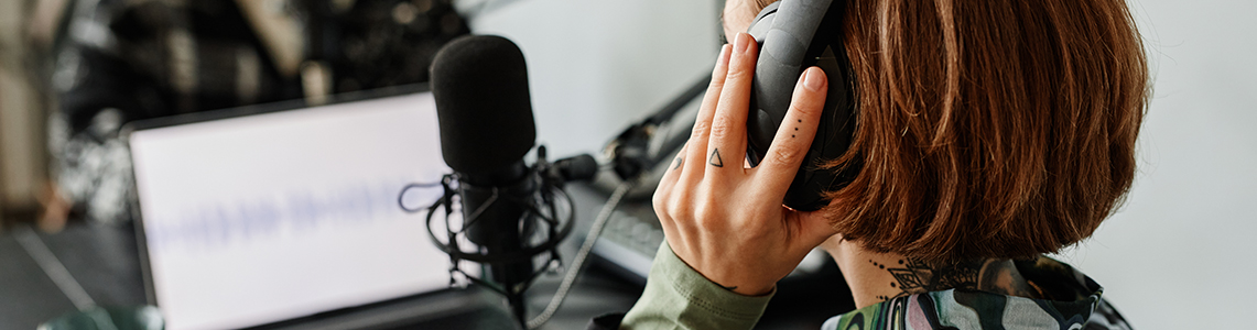 A person recording a podcast