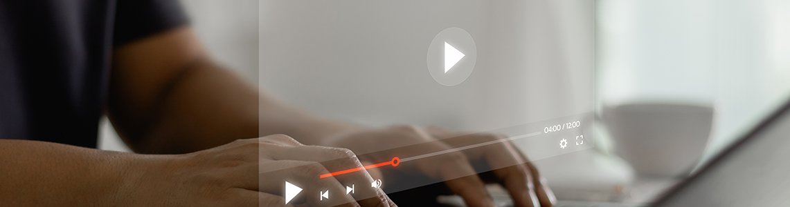 A person watching a video on a laptop