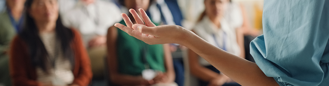 The hand of a person giving a talk